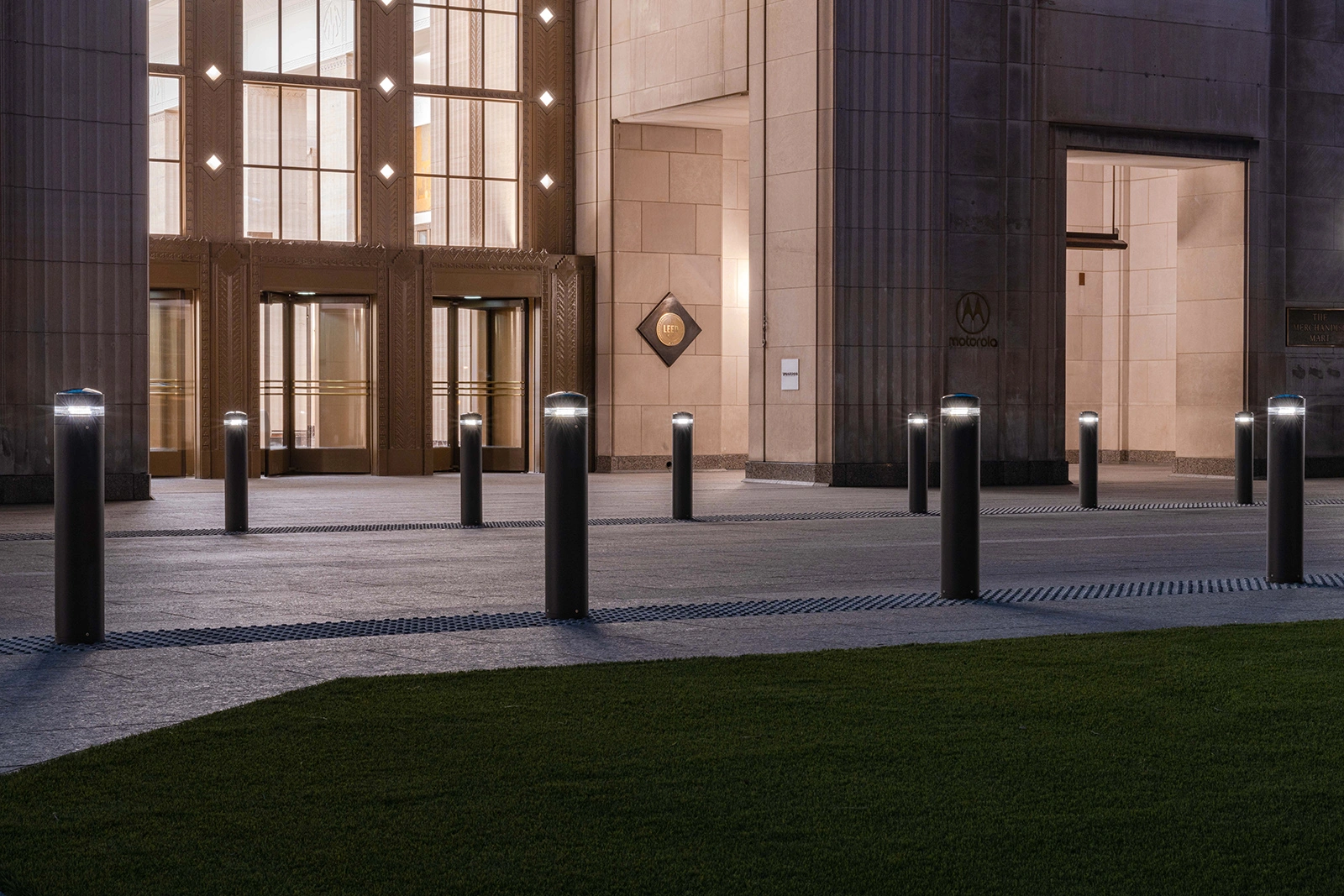 Exteria Lighting SP-010 solar LED bollards illuminating the pedestrian walkway at Merchandise Mart Plaza, Chicago