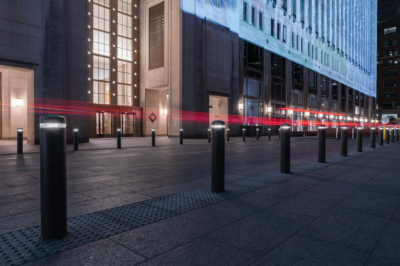 Exteria Lighting SP-010 solar LED bollards illuminating the pedestrian walkway at Merchandise Mart Plaza, Chicago